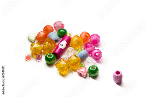a handful of beads isolated on white background