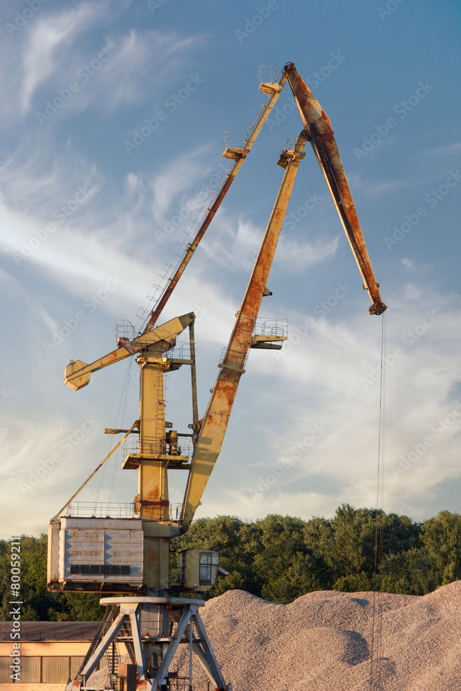 Crane loading cargo in the port on Moscow River, Russia Crane loading cargo in the port on Moscow River, Russia