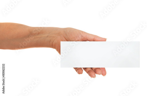 Hand holding white paper, cardboard