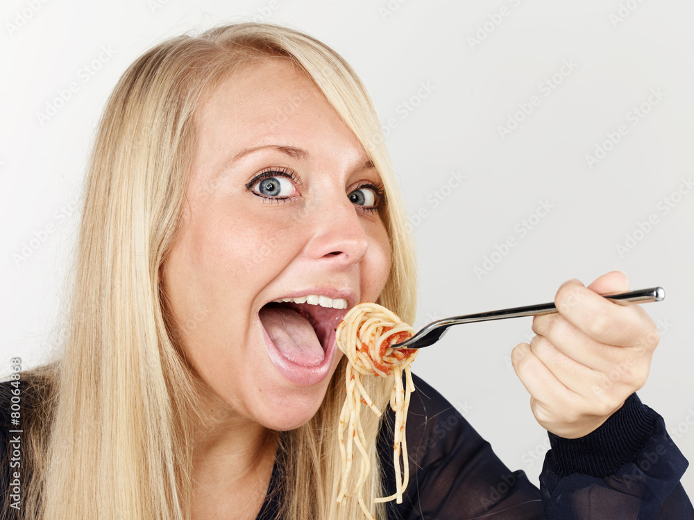 Woman is eating spaghetti