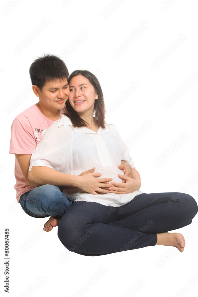 Smiling Asia husband touching the belly of his pregnant wife Smiling Asia husband touching the belly of his pregnant wife