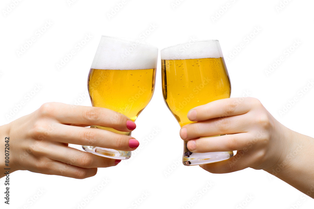 Two arms with glasses of beer isolated on white Two arms with glasses of beer isolated on white