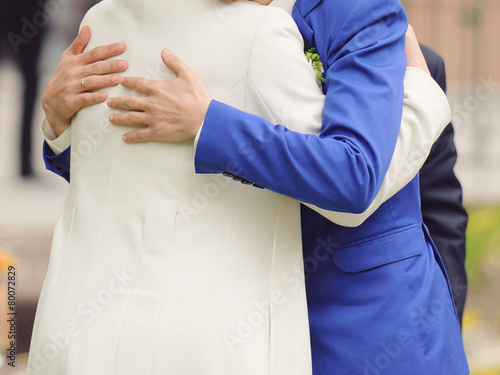 Groom Hugging Mother