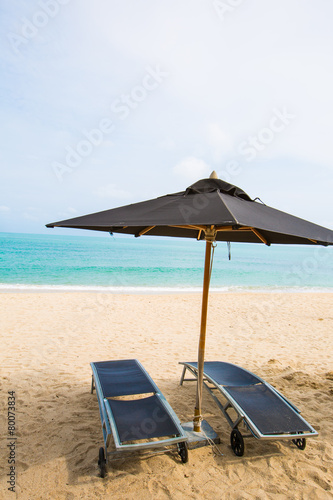 Beach chairs with umbrella at beach