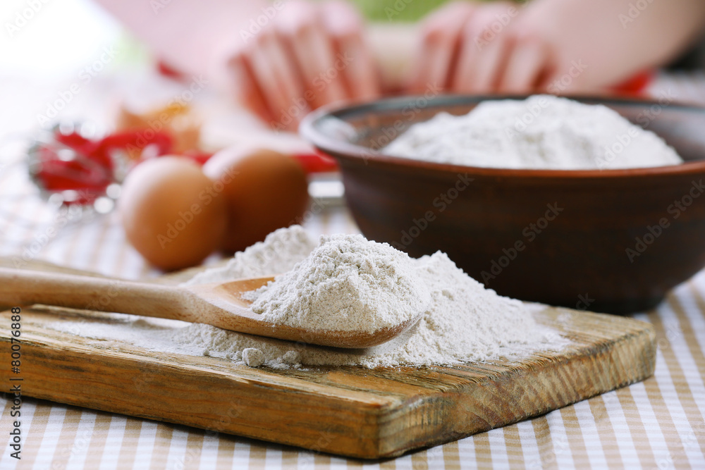 Young woman prepares dough on table close up Young woman prepares dough on table close up