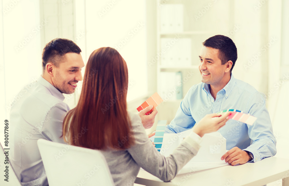couple looking at model of their house at office couple looking at model of their house at office
