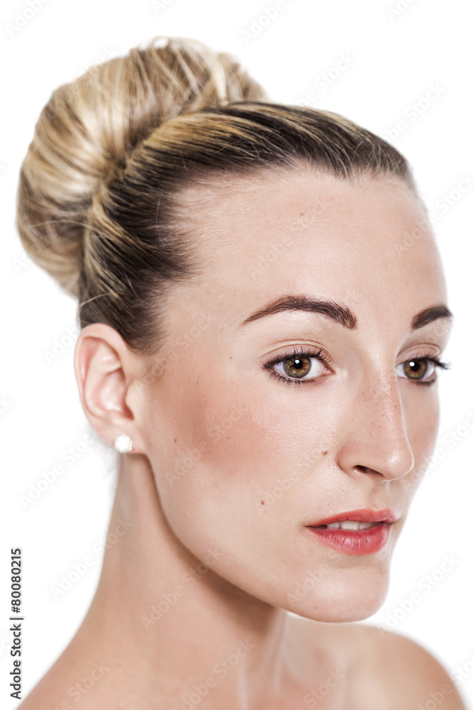 Blonde pretty girl with hair bun closeup