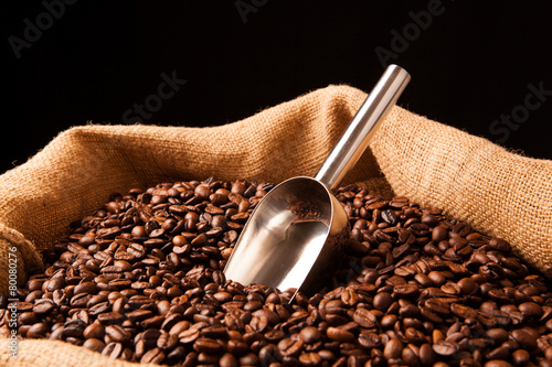 roasted coffee beans with scoop in bag