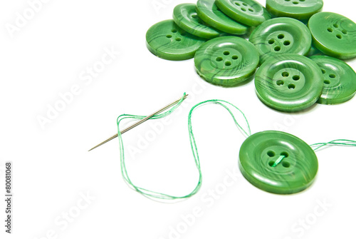 Obraz na płótnie green thread and buttons on white w salonie