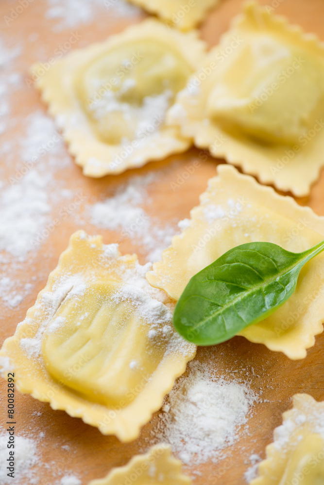 Close-up of raw square italian ravioli with flour, studio shot Close-up of raw square italian ravioli with flour, studio shot