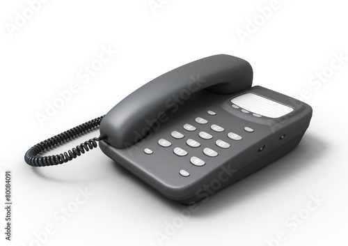 Stationary push-button telephone on a white