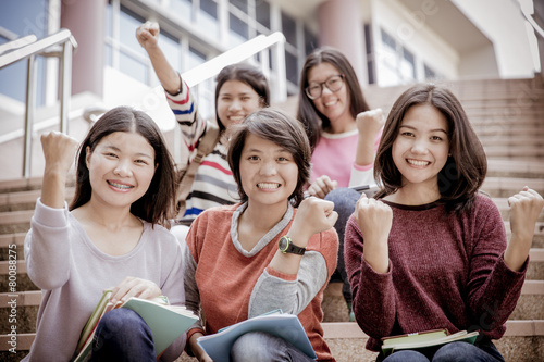 group of happy teen high school students outdoors