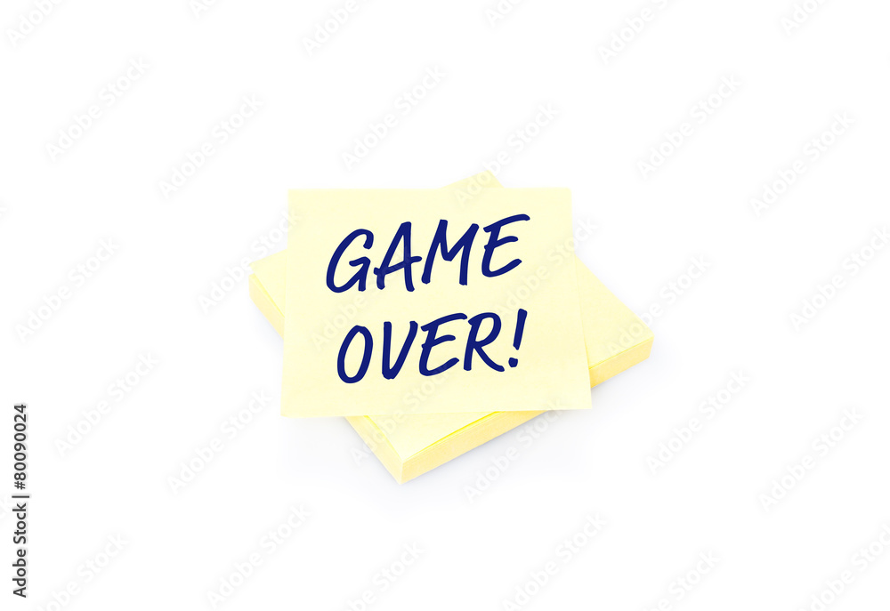 Yellow sticky note on block with text Game Over Yellow sticky note on block with text Game Over