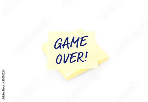 Yellow sticky note on block with text Game Over