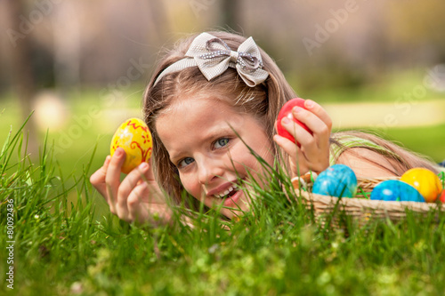 Canvas Print Child find easter egg outdoor.