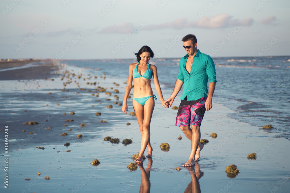 boy and girl fooling around on the beach, have fun and enjoy boy and girl fooling around on the beach, have fun and enjoy