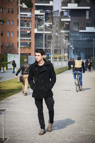 Stylish Young Handsome Man in Black Coat Standing in City Center