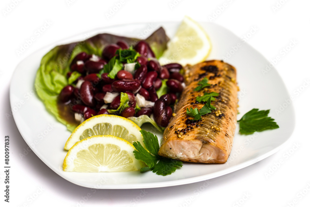 Salmon fillet grilled with bean salad, lemon and parsley Salmon fillet grilled with bean salad, lemon and parsley