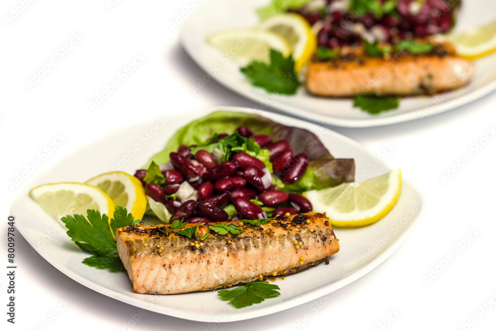 Salmon fillet grilled with bean salad, lemon and parsley