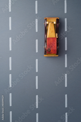 Vintage wooden toy car and a road doodle