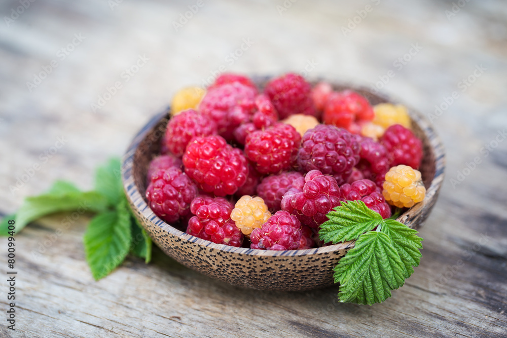 Fresh sweet tasty raspberries on wooden background Fresh sweet tasty raspberries on wooden background