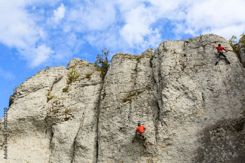 Rock climber on limestone rock near Krakow, Poland Rock climber on limestone rock near Krakow, Poland