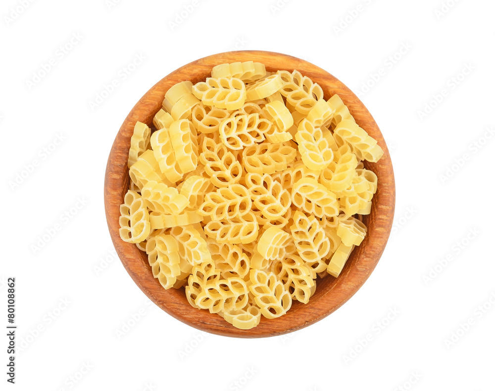 Pasta in wooden bowl, isolated on white background Pasta in wooden bowl, isolated on white background