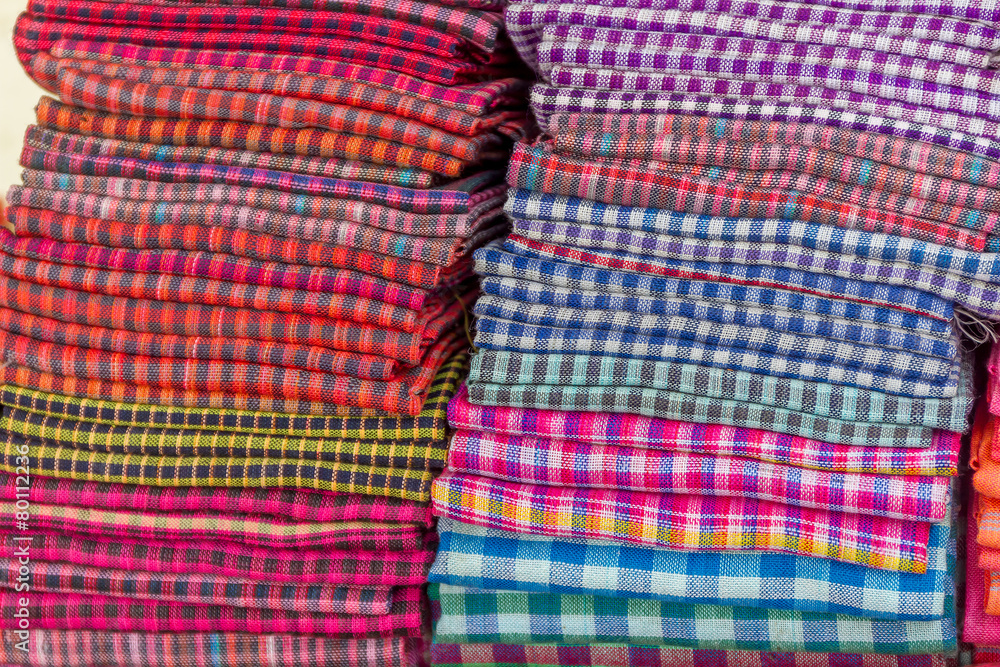 cotton material in piles, souvenir shop, cambodia