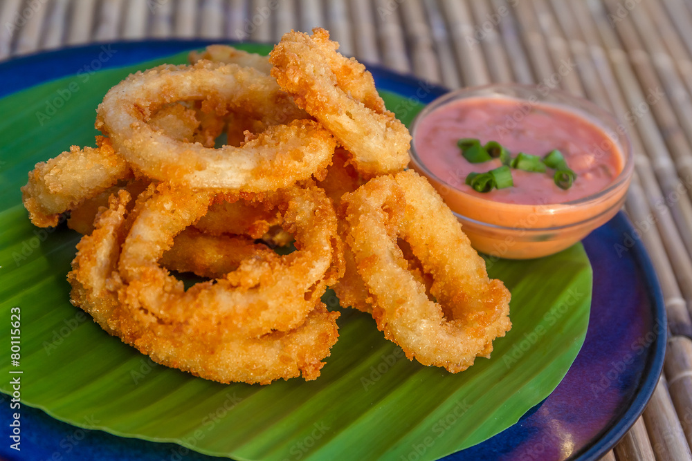 seafood snacks, calamaris, squid rings served in outdoor restaur