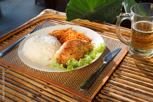 Chicken escalope with steamed rice and carrot salad photo