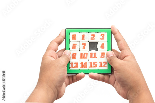 Hand holding Number Slider Puzzle photo