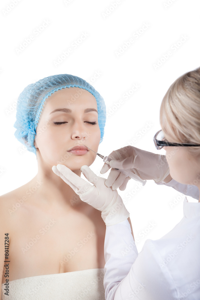 Beautiful woman gets an injection in her face Beautiful woman gets an injection in her face