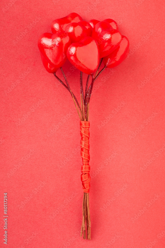 Heart glossy bunch on red background