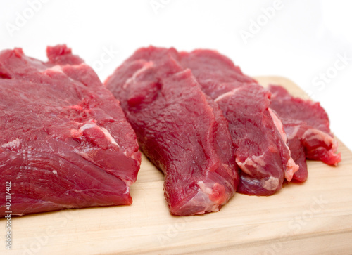 beef fillet on a board isolated on white background