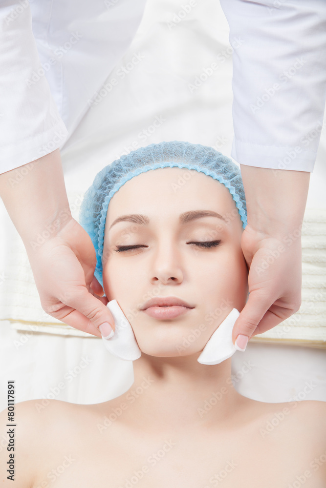 Woman getting face treatment in medical spa center