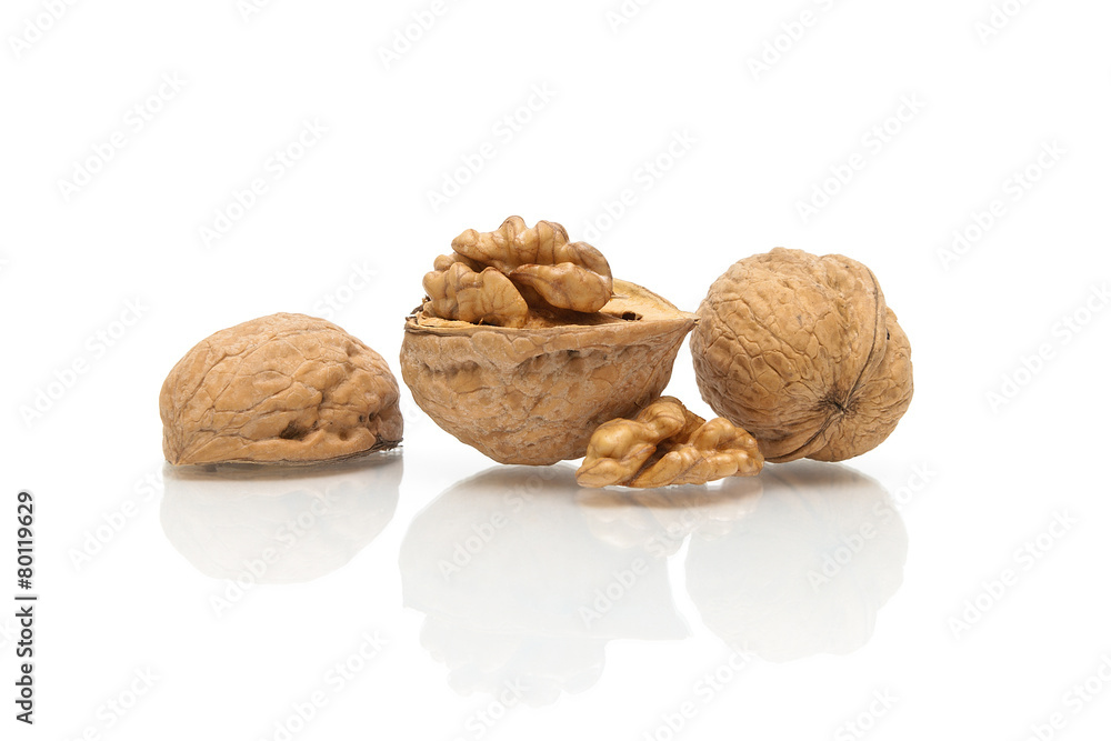Walnuts close up on white background with reflection Walnuts close up on white background with reflection