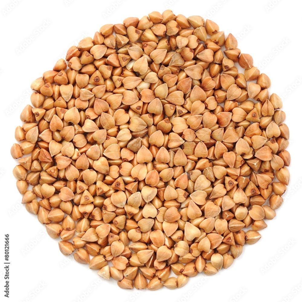 Wholegrain buckwheat in round shape, isolated Wholegrain buckwheat in round shape, isolated