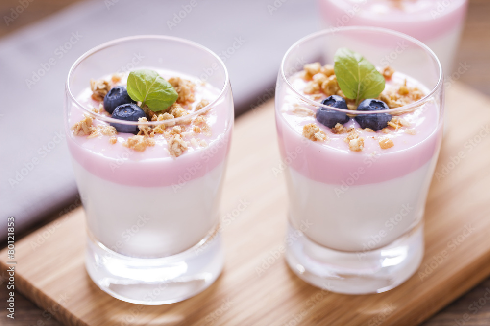 Delicious dessert, flakes flooded in two flavors yogurt with blu Delicious dessert, flakes flooded in two flavors yogurt with blu