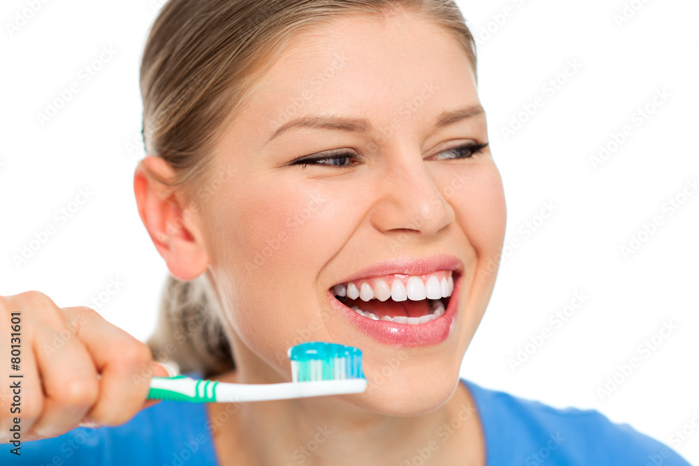 Portrait of happy smiling female holding brush with toothpaste Portrait of happy smiling female holding brush with toothpaste