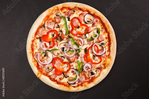 Tasty Italian pizza with mushrooms pepper onion sausage