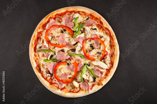 Tasty Italian pizza with mushrooms pepper hamon and chicken