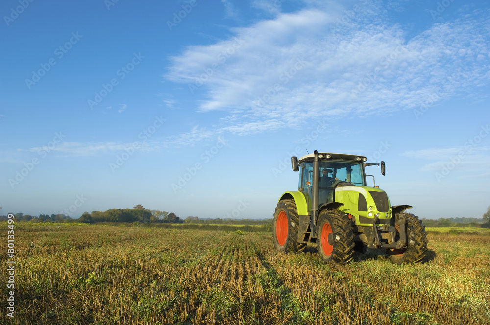 A tractor in a stubble field in Gloucestershire. A tractor in a stubble field in Gloucestershire.
