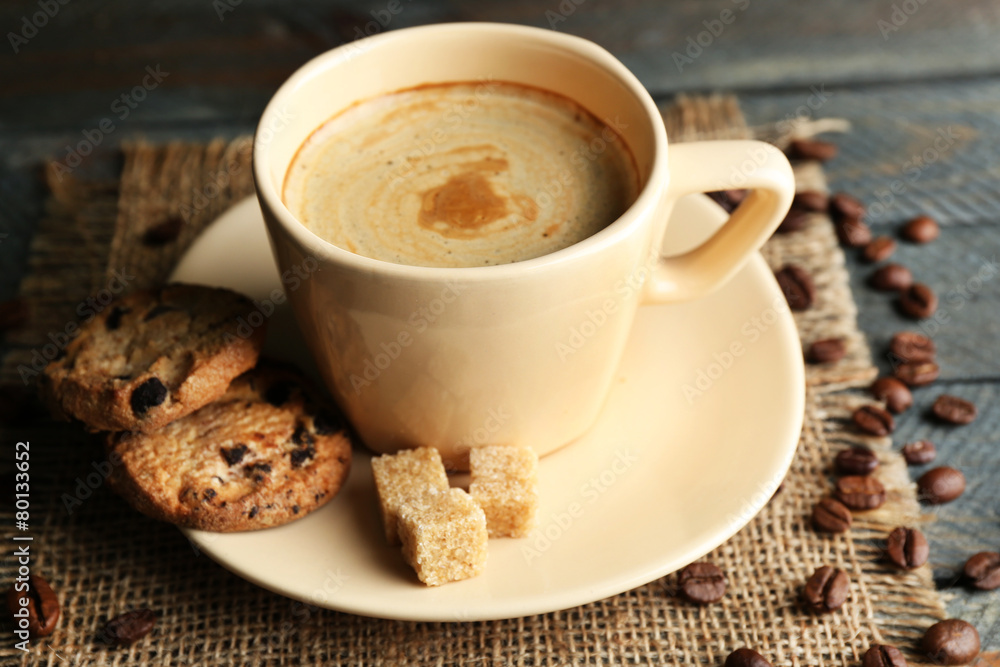 Cup of coffee and tasty cookies on wooden background Cup of coffee and tasty cookies on wooden background