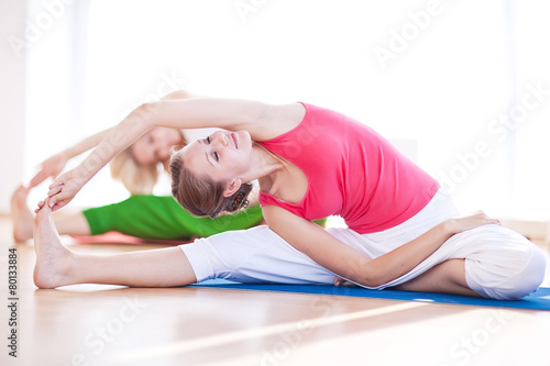 Two yogas woman indoors