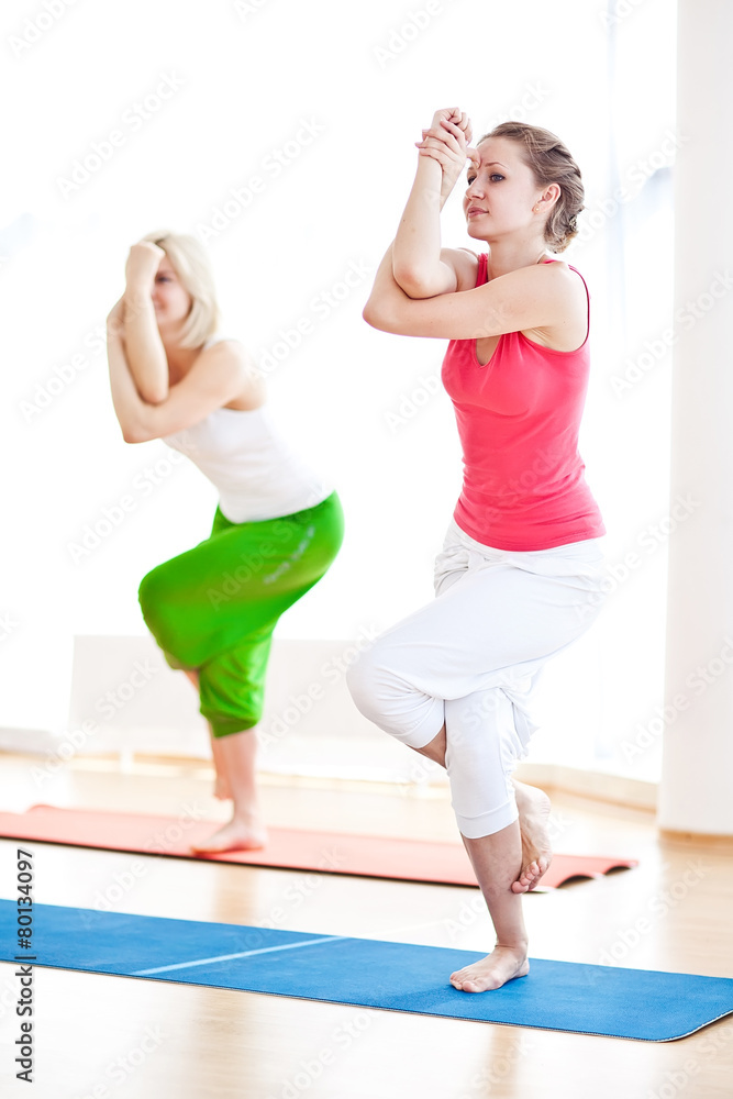 Two yogas woman indoors Two yogas woman indoors