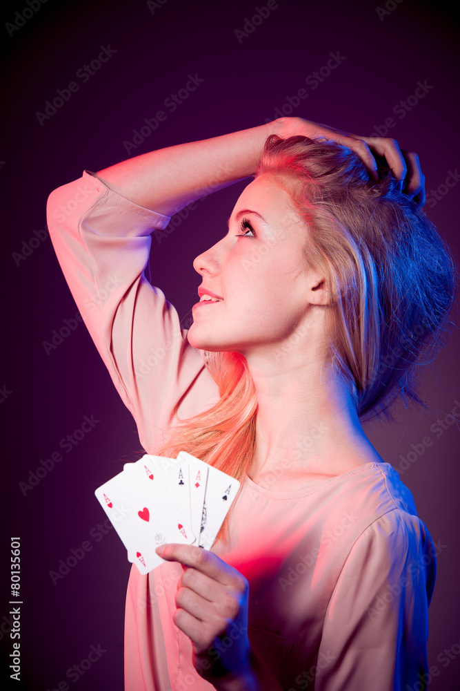 Beautiful caucasian woman with poker cards gambling in casino Beautiful caucasian woman with poker cards gambling in casino