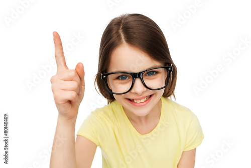 smiling little girl in eyeglasses