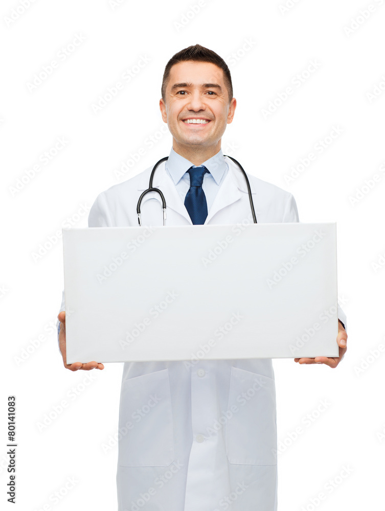 smiling male doctor holding white blank board