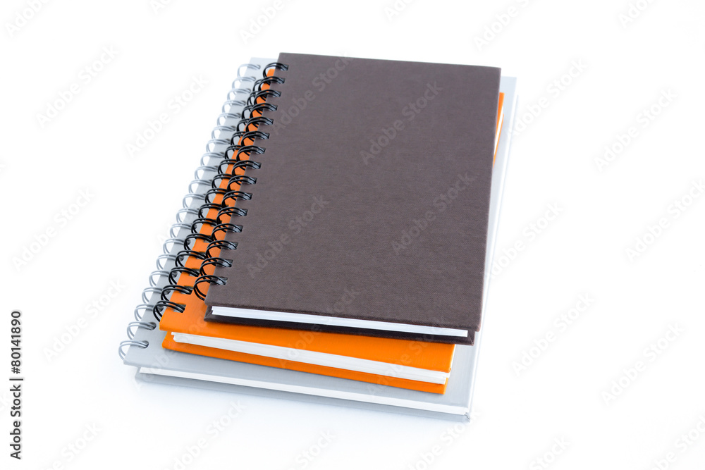 Stack of notebooks (or copybooks) isolated on white background Stack of notebooks (or copybooks) isolated on white background