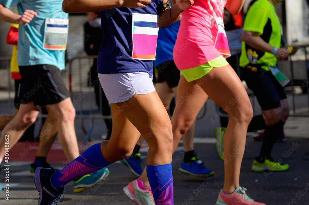 Marathon running race, people feet on road, women run Marathon running race, people feet on road, women run